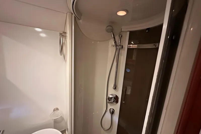  Yacht Photos Pics Shower area inside 2006 Sunseeker Sportfisher 37 yacht, featuring modern fixtures and lighting.