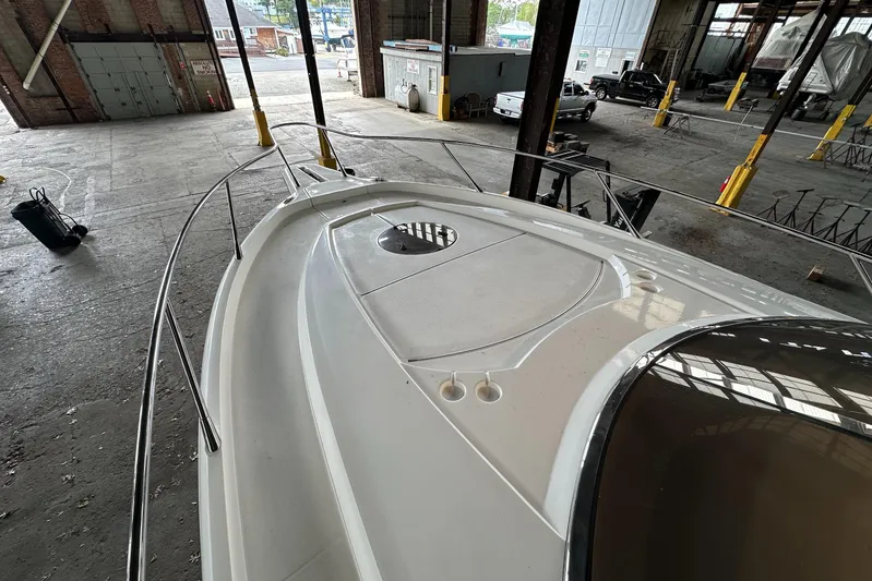  Yacht Photos Pics 2006 Sunseeker Sportfisher 37 boat in a warehouse, showcasing sleek deck design.