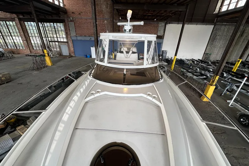  Yacht Photos Pics 2006 Sunseeker Sportfisher 37 boat in industrial warehouse setting.