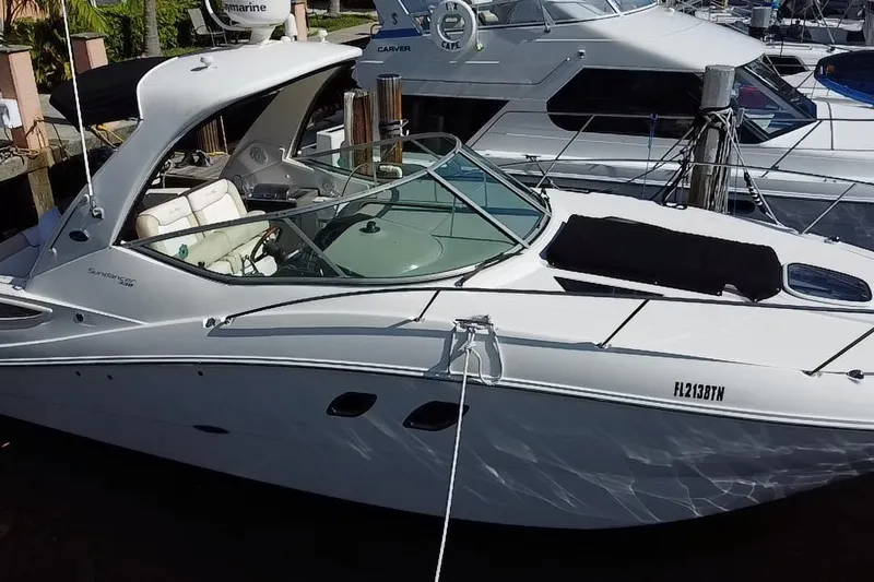  Yacht Photos Pics 2012 Sea Ray 330 Sundancer yacht docked at marina, featuring sleek design and spacious cockpit.