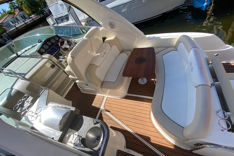  Yacht Photos Pics Luxurious 2012 Sea Ray 330 Sundancer yacht interior with seating, table, and helm.