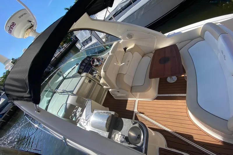  Yacht Photos Pics Luxurious 2012 Sea Ray 330 Sundancer yacht interior with seating and wooden deck.