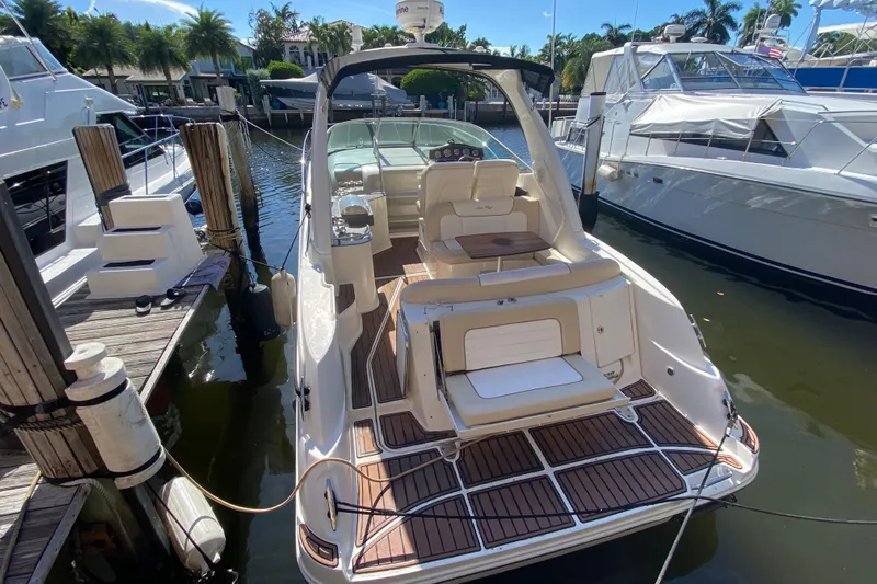  Yacht Photos Pics 2012 Sea Ray 330 Sundancer docked, featuring spacious deck and luxurious seating.