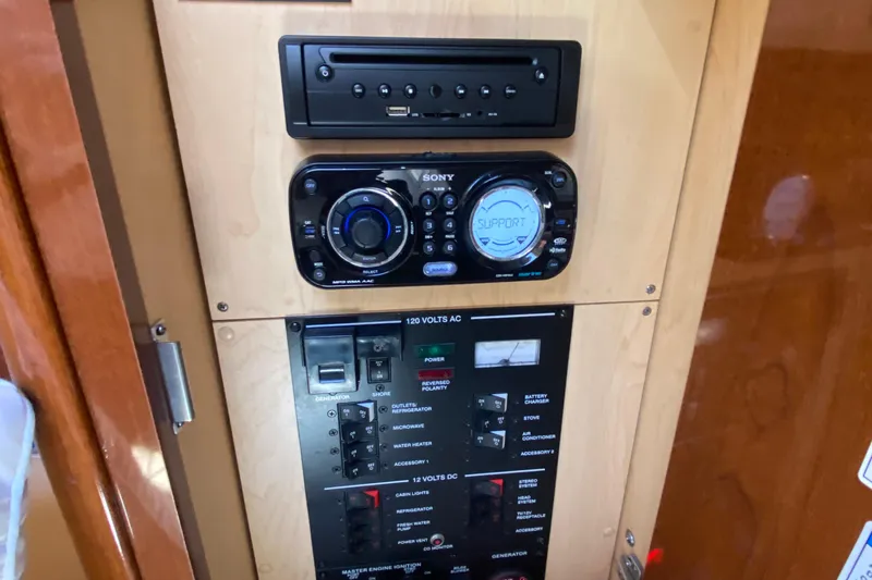  Yacht Photos Pics Control panel of a 2012 Sea Ray 330 Sundancer boat with audio system and switches.