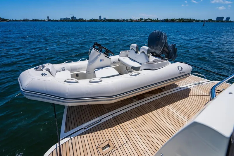  Yacht Photos Pics Inflatable boat on Prestige 500S yacht, 2018 model, docked on calm blue water.