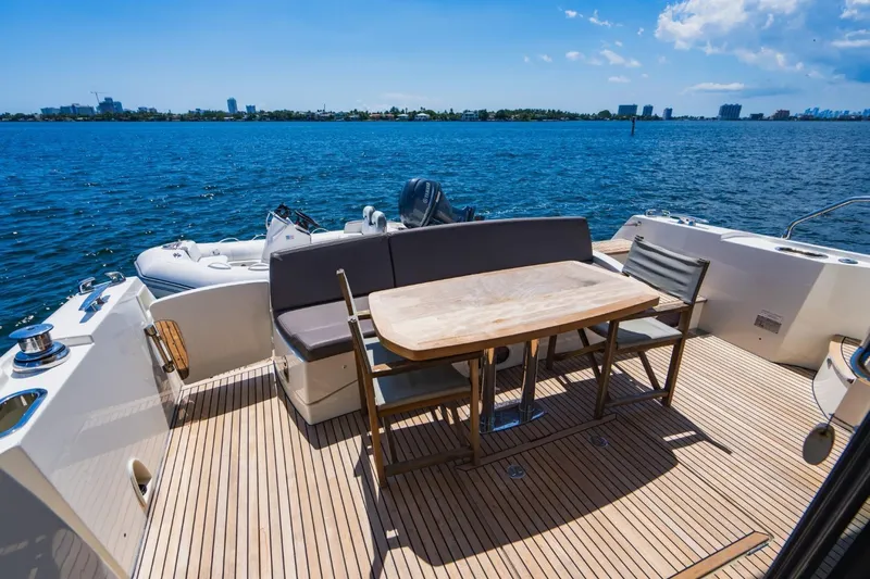  Yacht Photos Pics Luxurious 2018 Prestige 500S yacht deck with seating, table, and ocean view.