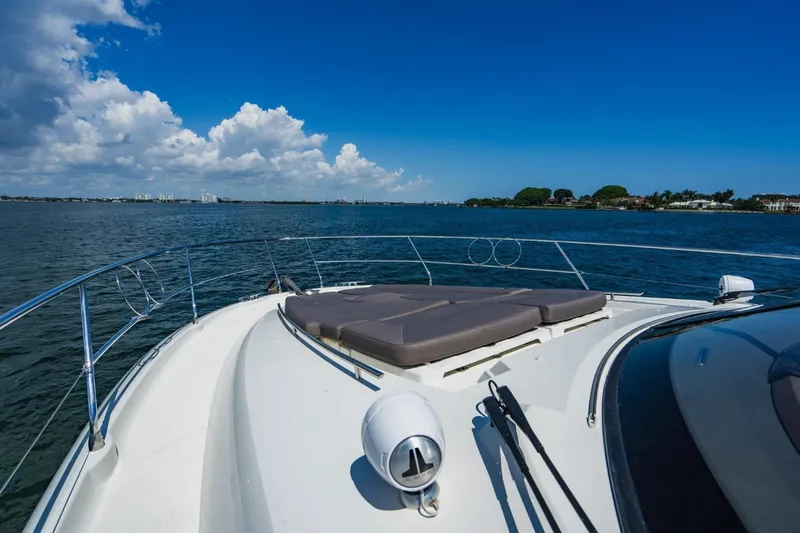  Yacht Photos Pics Prestige 500S 2018 yacht cruising on a sunny day with clear blue skies.