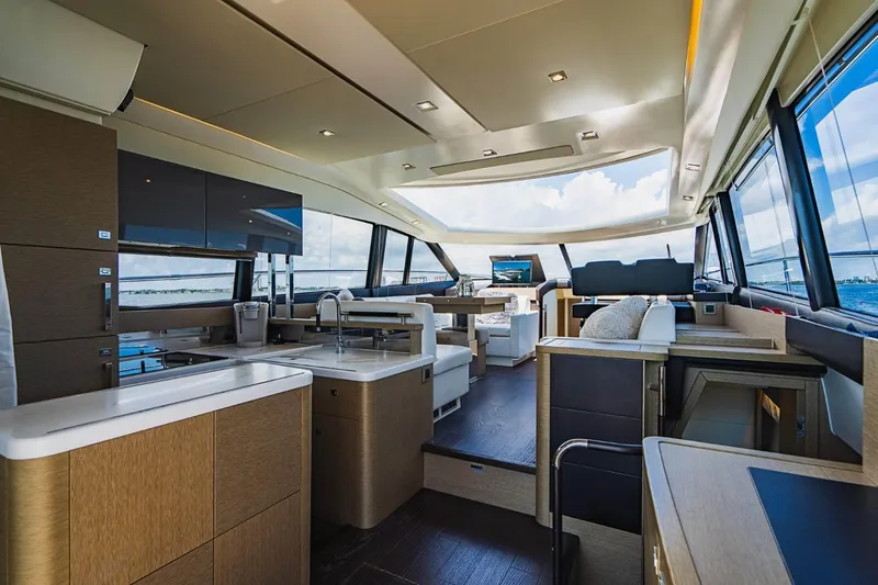  Yacht Photos Pics Luxurious interior of a 2018 Prestige 500S yacht with modern furnishings and panoramic windows.
