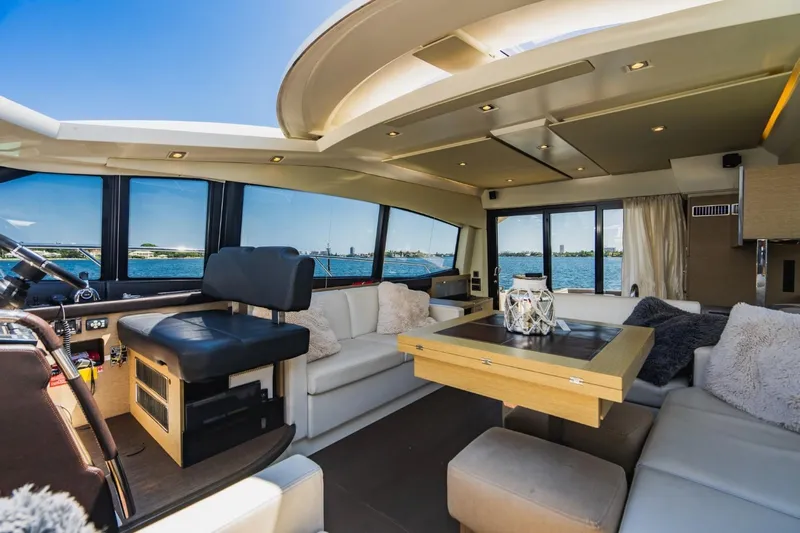  Yacht Photos Pics Luxurious interior of 2018 Prestige 500S yacht with elegant seating and scenic ocean views.