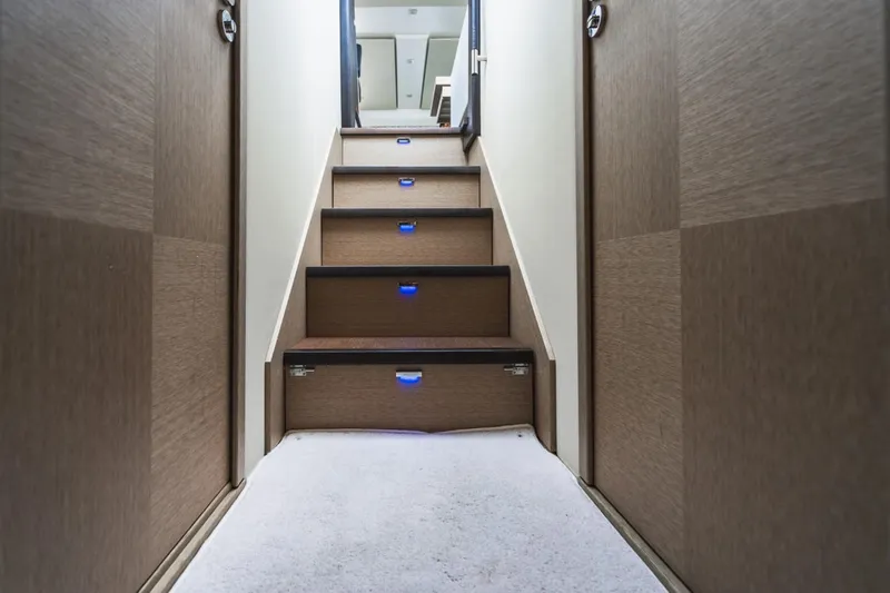  Yacht Photos Pics Staircase with blue LED lights inside 2018 Prestige 500S yacht.