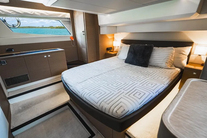  Yacht Photos Pics Luxurious 2018 Prestige 500S yacht bedroom with modern decor and scenic window view.