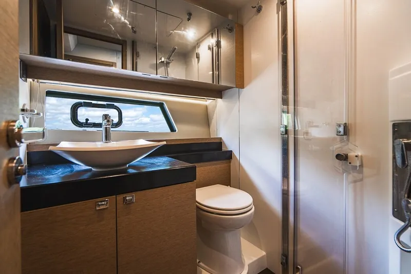  Yacht Photos Pics Luxurious bathroom in 2018 Prestige 500S yacht with modern fixtures and elegant design.