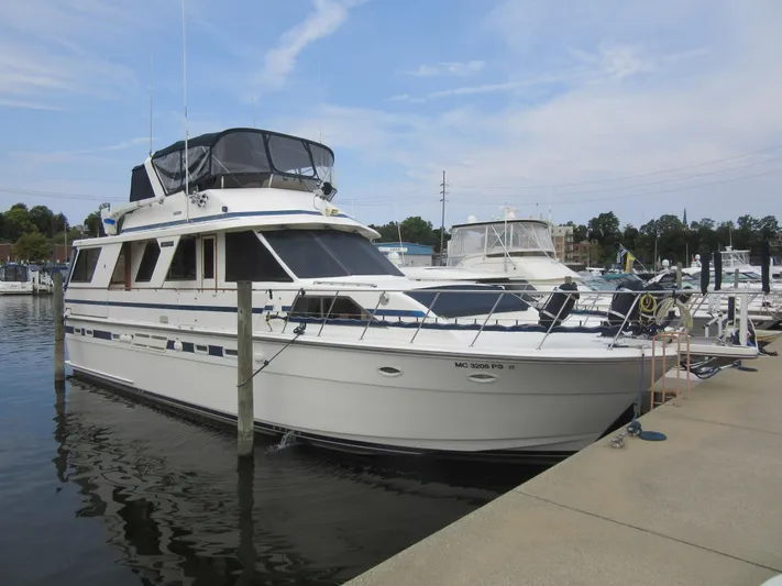 Laura Lee Yacht Photos Pics 1990 Jefferson Marquessa 52 yacht docked at marina under clear sky.