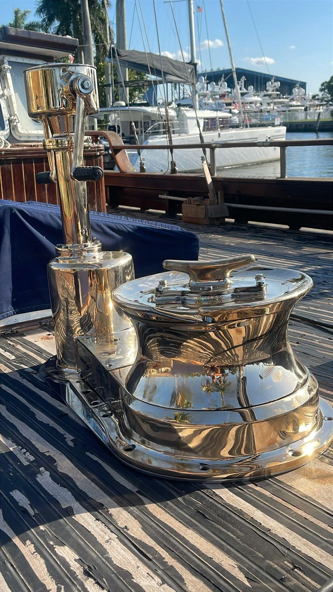 Polished winch on 1991 Custom Horacio Carabelli Schooner, docked at marina.