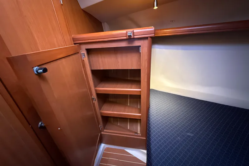 Murrelet Yacht Photos Pics Wooden cabinet and bed in 2009 Hunter 38 yacht interior.