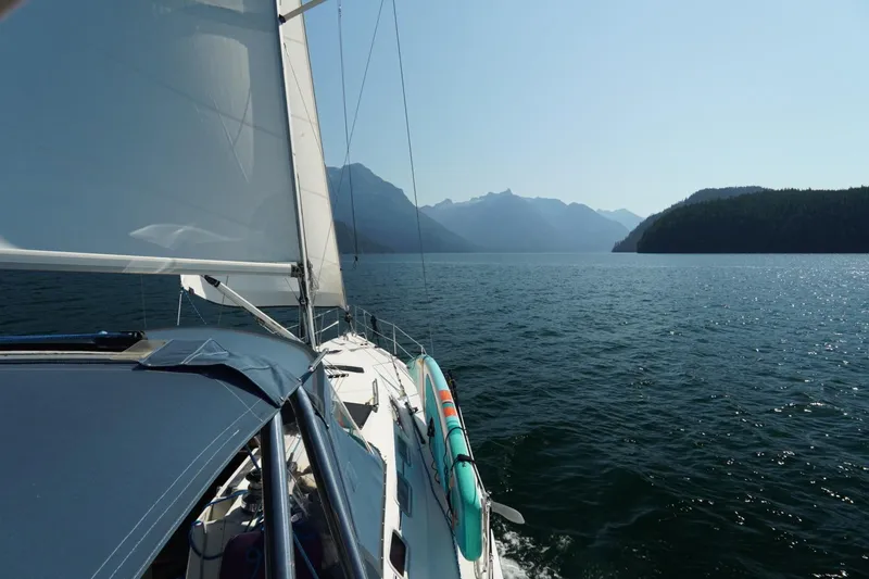 Murrelet Yacht Photos Pics Sailing on a 2009 Hunter 38 yacht in a serene mountain lake.
