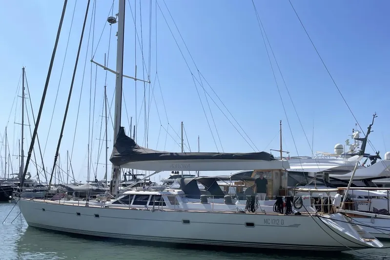  Yacht Photos Pics Baltic 73 Pilothouse yacht from 1999 docked in a marina under clear blue skies.