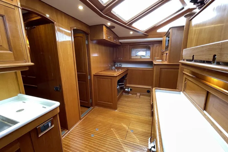  Yacht Photos Pics Luxurious wooden interior of 1999 Baltic 73 Pilothouse yacht kitchen.