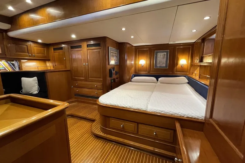  Yacht Photos Pics Luxurious 1999 Baltic 73 Pilothouse yacht interior with elegant wood finish and cozy double bed.