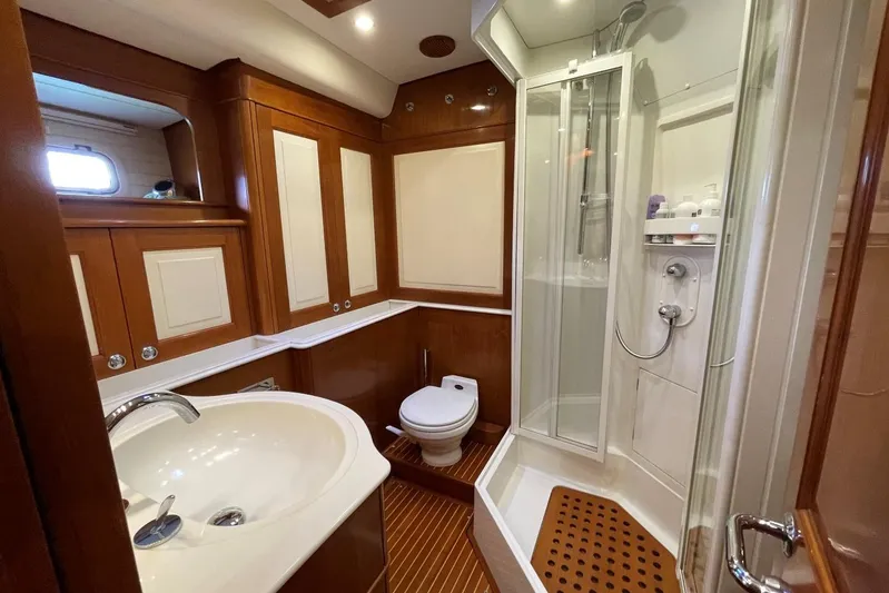  Yacht Photos Pics Luxurious bathroom in 1999 Baltic 73 Pilothouse yacht with shower, sink, and toilet.