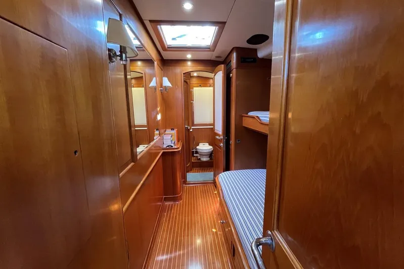  Yacht Photos Pics Luxurious wooden interior of 1999 Baltic 73 Pilothouse yacht cabin with bunk beds.