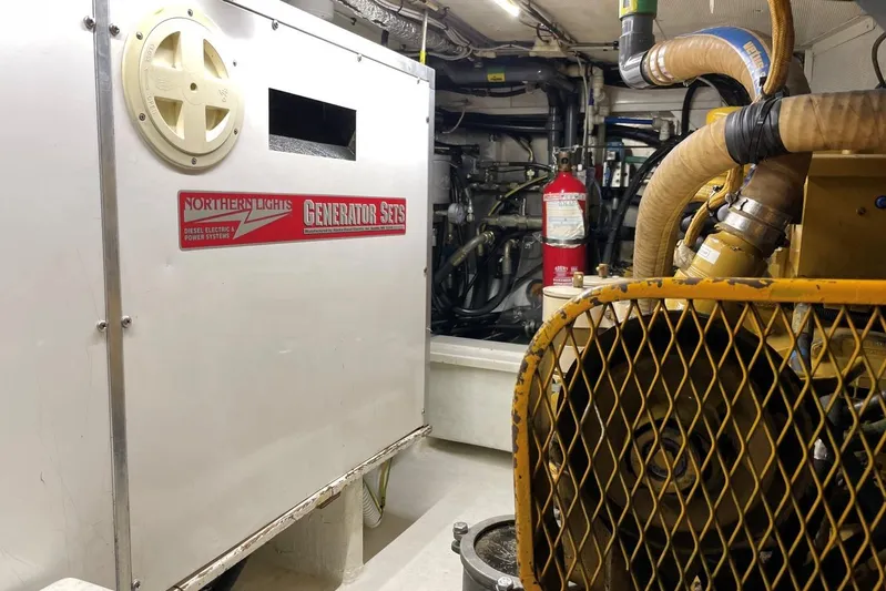  Yacht Photos Pics Engine room of 1999 Baltic 73 Pilothouse with Northern Lights generator and machinery.