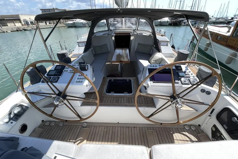  Yacht Photos Pics Cockpit of 1999 Baltic 73 Pilothouse yacht with dual steering wheels and navigation equipment.