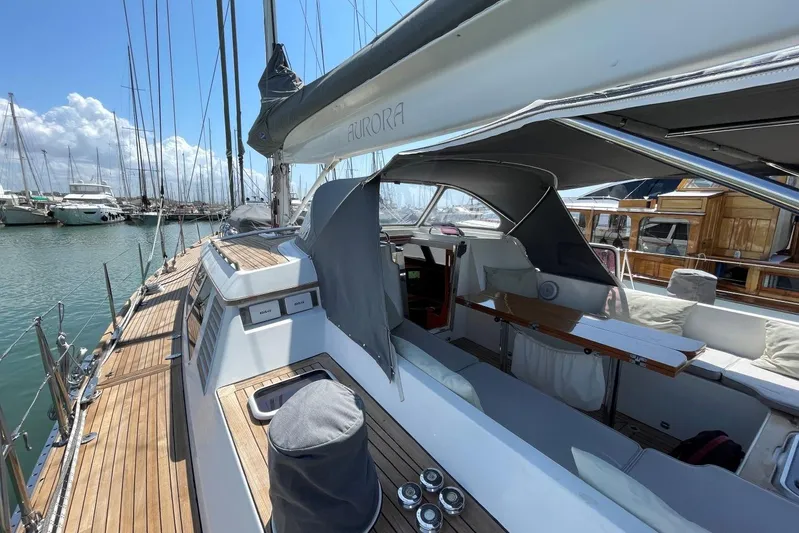  Yacht Photos Pics 1999 Baltic 73 Pilothouse yacht with teak deck and covered cockpit in marina.