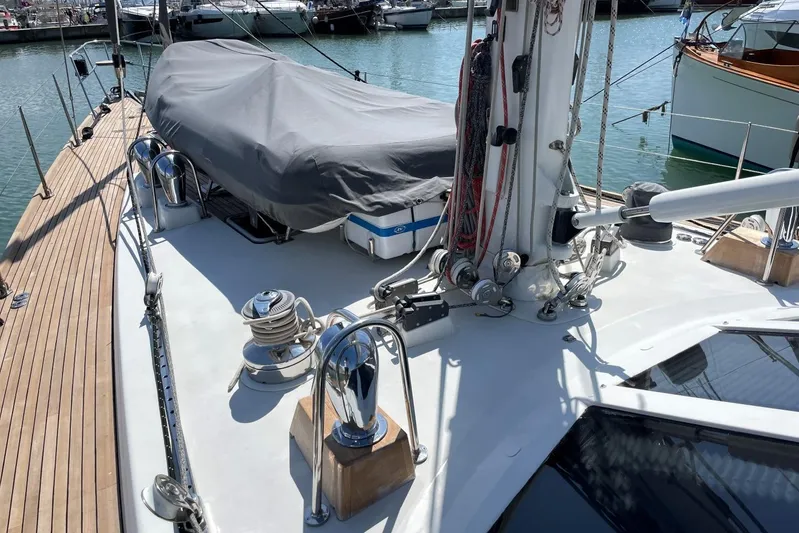  Yacht Photos Pics Deck view of a 1999 Baltic 73 Pilothouse yacht, featuring winches and covered equipment.