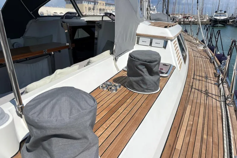  Yacht Photos Pics Baltic 73 Pilothouse 1999 yacht deck with teak flooring and covered equipment.