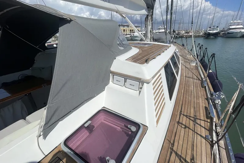  Yacht Photos Pics Baltic 73 Pilothouse yacht, 1999 model, with wooden deck and canopy in marina.