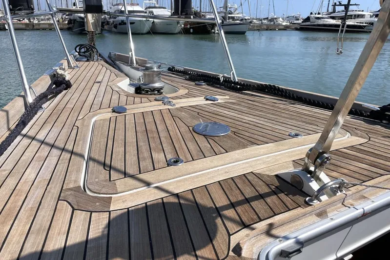  Yacht Photos Pics Deck of 1999 Baltic 73 Pilothouse yacht in marina, showcasing teak wood finish.