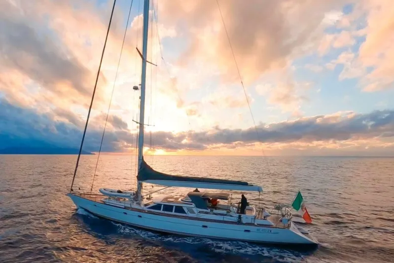  Yacht Photos Pics Sailing yacht Baltic 73 Pilothouse (1999) on open sea at sunset.