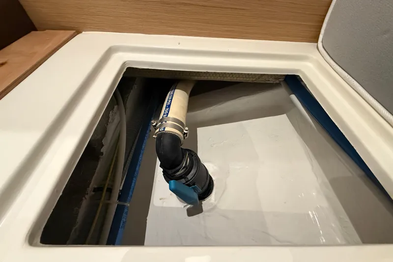George Yacht Photos Pics Bilge compartment of 2024 Pardo Yachts 43, featuring plumbing and hose connections.