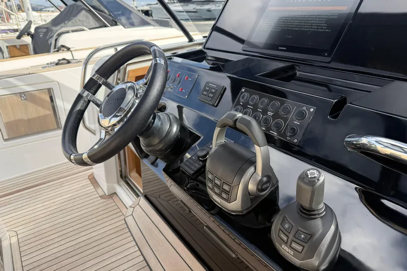 George Yacht Photos Pics 2024 Pardo Yachts 43 helm with steering wheel and control panel.