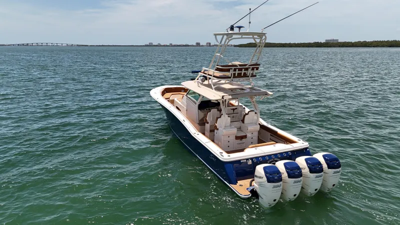  Yacht Photos Pics 2018 Scout 420 LXF boat on open water with four engines.