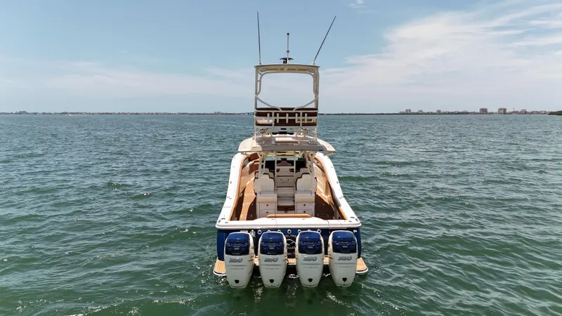  Yacht Photos Pics 2018 Scout 420 LXF boat with four engines on open water.