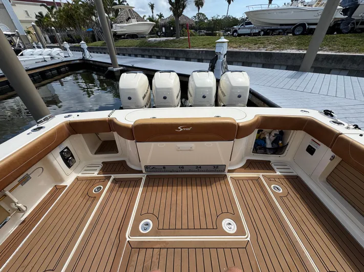 Yacht Photos Pics 2018 Scout 420 LXF boat deck with quad engines, docked at marina.
