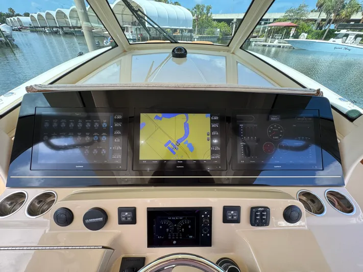  Yacht Photos Pics Dashboard of a 2018 Scout 420 LXF boat with navigation screens and controls.