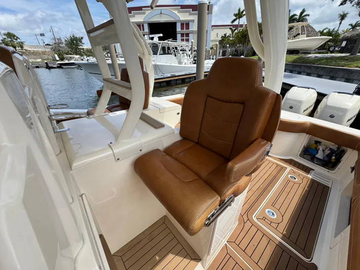  Yacht Photos Pics Luxurious seating on 2018 Scout 420 LXF boat, docked at marina.