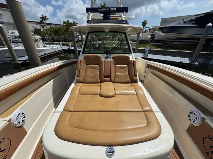  Yacht Photos Pics 2018 Scout 420 LXF boat with tan leather seating and Garmin navigation system.