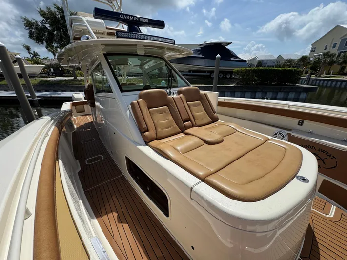  Yacht Photos Pics 2018 Scout 420 LXF boat with tan leather seating and Garmin equipment.