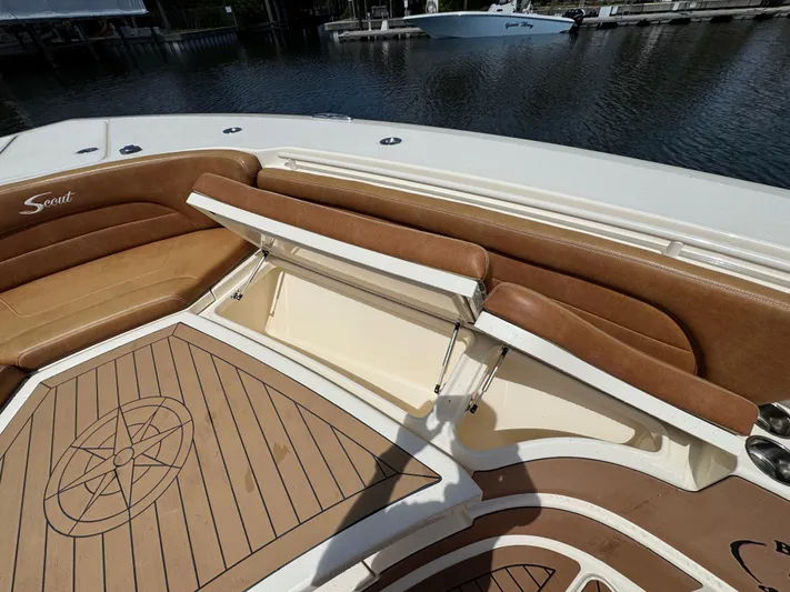  Yacht Photos Pics 2018 Scout 420 LXF boat with tan leather seating and storage compartment.
