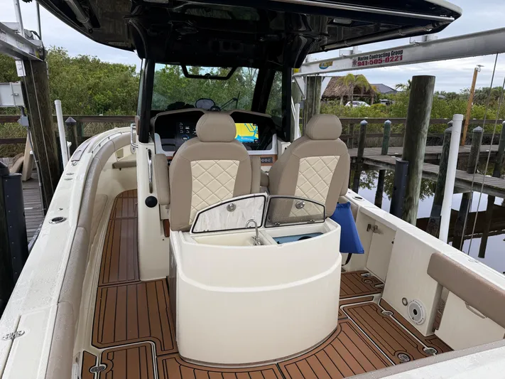  Yacht Photos Pics 2024 Chris-Craft Catalina 30 boat interior with seating and navigation system.