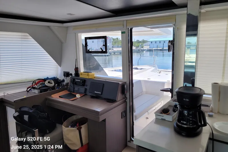 Making Connections II Yacht Photos Pics Interior of a 2022 Leopard 45 yacht with navigation equipment and coffee maker.