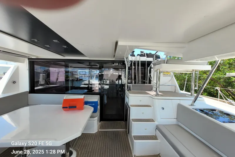 Making Connections II Yacht Photos Pics Interior of 2022 Leopard 45 yacht with modern seating and dining area.