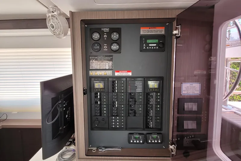 Making Connections II Yacht Photos Pics Electrical control panel inside a 2022 Leopard 45 yacht, featuring switches and gauges.
