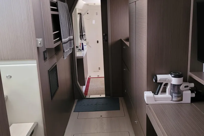 Making Connections II Yacht Photos Pics Modern interior of 2022 Leopard 45 yacht with sleek wood finishes and compact design.