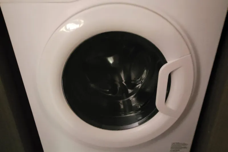 Making Connections II Yacht Photos Pics Front-loading washing machine, Leopard 45 model, 2022, with a sleek white design.