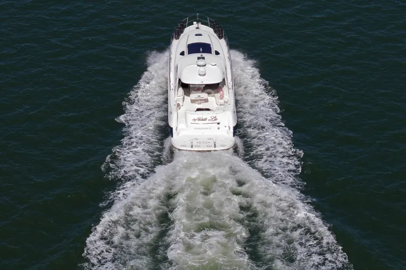 Nauti Lis Yacht Photos Pics 2005 Sea Ray 500 Sundancer yacht cruising on open water, aerial view.